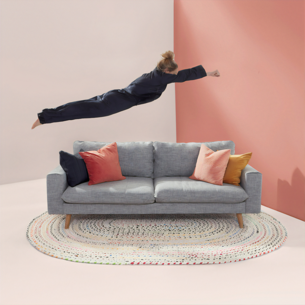 Woman jumping on couch